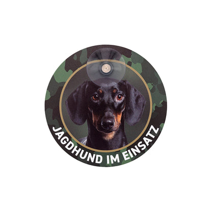 Rundes Dackelschild für die Autoscheibe mit Kurzhaardackel, Teckel Motiv und der Aufschrift Jagdhund im Einsatz