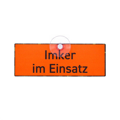Imker Schild in Signalfarbe mit der Aufschrift "Imker im Einsatz" und Saugnapf für die Autoscheibe